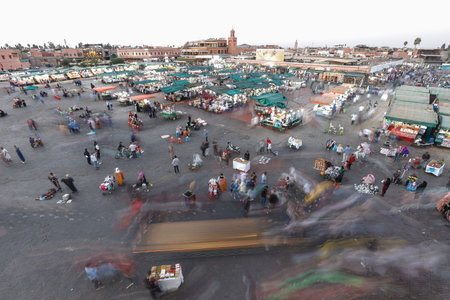 MARRAKESH, MOROCCO - OCTOBER 29, 2021: People in Jemaa el-Fnaa where main square of Marrakesh, used...