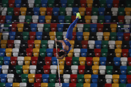 ISTANBUL, TURKEY - MARCH 05, 2022: Undefined athlete pole vaulting during Balkan Athletics Indoor Championships in Atakoy Athletics Arenaのeditorial素材