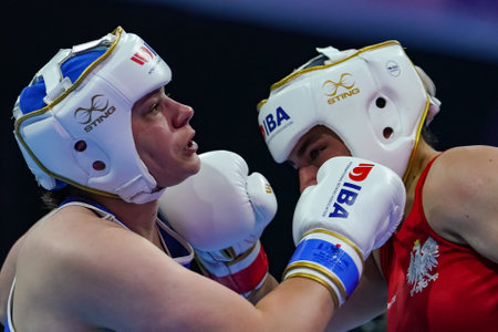 ISTANBUL, TURKEY - MAY 19, 2022: Toborek Oliwia (Red) and Stonkute Gabriele (Blue) compete during IBA Womens World Boxing Championshipsのeditorial素材