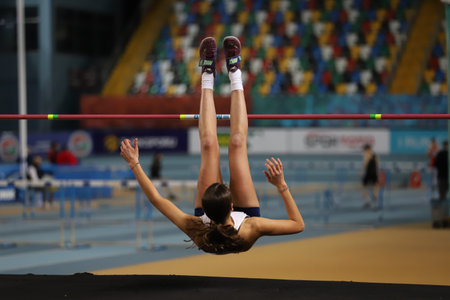 ISTANBUL, TURKEY - JANUARY 16, 2022: Undefined athlete high jumping during Turkish Athletic Federation Indoor Athletics Record Attempt Racesのeditorial素材