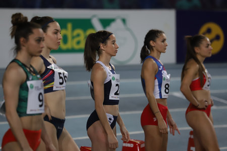 ISTANBUL, TURKEY - MARCH 05, 2022: Athletes running 60 metres during Balkan Athletics Indoor Championships in Atakoy Athletics Arenaのeditorial素材