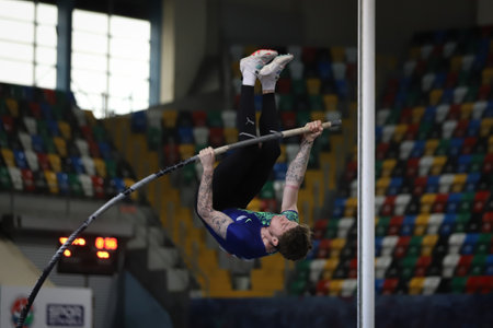 ISTANBUL, TURKEY - FEBRUARY 26, 2022: Undefined athlete pole vaulting during Turkish Indoor Athletics Championships in Atakoy Athletics Arenaのeditorial素材