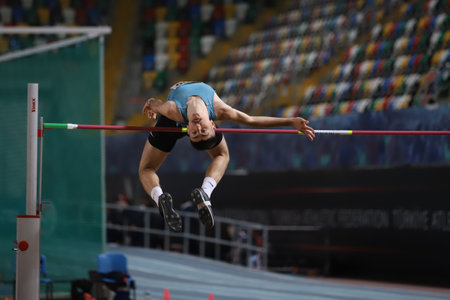 ISTANBUL, TURKEY - FEBRUARY 26, 2022: Undefined athlete high jumping during Turkish Indoor Athletics Championships in Atakoy Athletics Arenaのeditorial素材