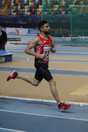 ISTANBUL, TURKEY - MARCH 05, 2022: Salih Teksoz running during Balkan Athletics Indoor Championships in Atakoy Athletics Arenaのeditorial素材