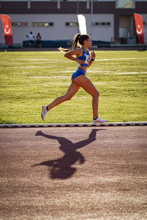 DENIZLI, TURKIYE - JULY 16, 2022: Undefined athlete running during Balkan Athletics U20 Championships in Denizli Albayrak Athletics Trackのeditorial素材