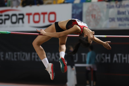 ISTANBUL, TURKEY - MARCH 05, 2022: Undefined athlete high jumping during Balkan Athletics Indoor Championships in Atakoy Athletics Arenaのeditorial素材