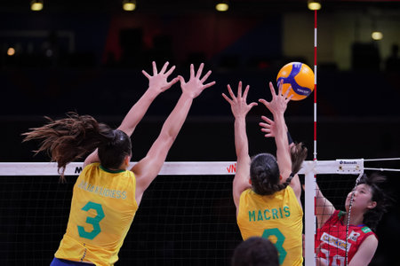 ANKARA, TURKIYE - JULY 13, 2022: Gambatto Kudiess Julia and Silva Carneiro Macris Fernanda in action during Brazil vs Japan VNL Quarter Final match in Ankara Arenaのeditorial素材