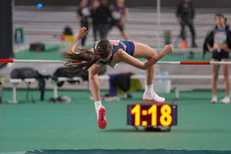 ISTANBUL, TURKIYE - FEBRUARY 28, 2023: Undefined athlete high jumping during European Athletics Indoor Championships Test Races in Atakoy Athletics Arenaのeditorial素材