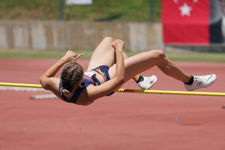 DENIZLI, TURKIYE - JULY 16, 2022: Undefined athlete high jumping during Balkan Athletics U20 Championships in Denizli Albayrak Athletics Trackのeditorial素材