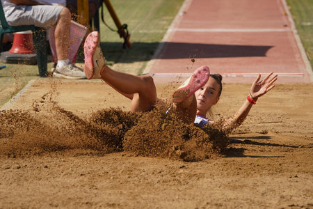 DENIZLI, TURKIYE - JULY 17, 2022: Undefined athlete long jumping during Balkan Athletics U20 Championships in Denizli Albayrak Athletics Trackのeditorial素材