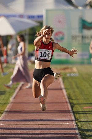 DENIZLI, TURKIYE - JULY 16, 2022: Undefined athlete triple jumping during Balkan Athletics U20 Championships in Denizli Albayrak Athletics Trackのeditorial素材