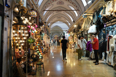 ISTANBUL, TURKIYE - JULY 13, 2023: People shopping in the Grand Bazaar. The Grand Bazaar is one of...