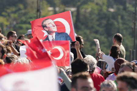 ISTANBUL, TURKIYE - NOVEMBER 05, 2023: Athletes running witg flags in 45. Istanbul marathon which...