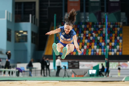 ISTANBUL, TURKIYE - FEBRUARY 17, 2024: Undefined athlete triple jumping during Turkish Indoor...