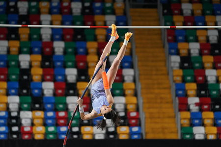 ISTANBUL, TURKIYE - FEBRUARY 17, 2024: Undefined athlete pole vaulting during Turkish Indoor Athletics Championships in Atakoy Athletics Arenaのeditorial素材