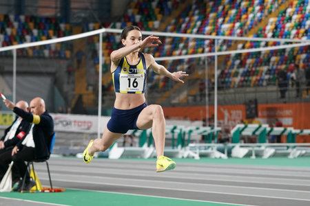 ISTANBUL, TURKIYE - FEBRUARY 17, 2024: Undefined athlete triple jumping during Turkish Indoor...