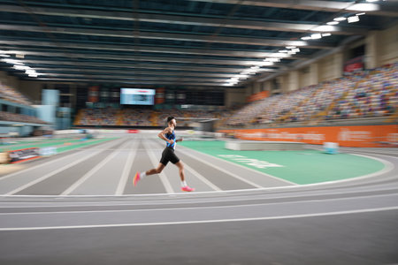 ISTANBUL, TURKIYE - FEBRUARY 17, 2024: Undefined athlete running during Turkish Indoor Athletics Championships in Atakoy Athletics Arenaのeditorial素材