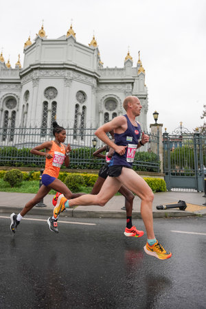 ISTANBUL, TURKIYE - APRIL 28, 2024: Athletes running Istanbul half marathon in historic street of Fener districtのeditorial素材