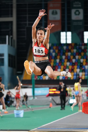 ISTANBUL, TURKIYE - FEBRUARY 10, 2024: Undefined athlete long jumping during Balkan Athletics...