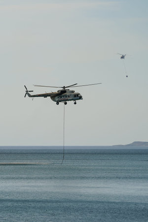 CANAKKALE, TURKIYE - JUNE 18, 2024: Trans Karavan Airlines Mil Mi-8MTV-1 (93284) extinguishing...
