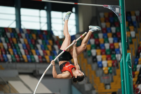 ISTANBUL, TURKIYE - FEBRUARY 10, 2024: Undefined athlete pole vaulting during Balkan Athletics...