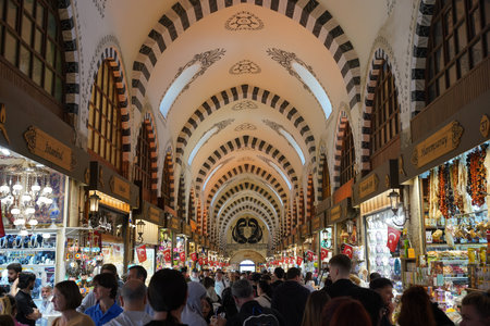 ISTANBUL, TURKIYE - APRIL 27, 2024: People shopping at Spice Bazaar. The Spice Bazaar is one of the...