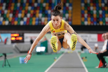 ISTANBUL, TURKIYE - FEBRUARY 10, 2024: Undefined athlete triple jumping during Balkan Athletics...