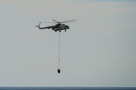 CANAKKALE, TURKIYE - JUNE 18, 2024: Trans Karavan Airlines Mil Mi-8MTV-1 (93284) extinguishing...