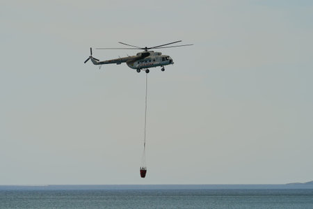 CANAKKALE, TURKIYE - JUNE 18, 2024: Trans Karavan Airlines Mil Mi-8MTV-1 (93284) extinguishing...