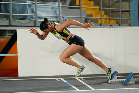 ISTANBUL, TURKIYE - FEBRUARY 23, 2025: Undefined athlete running during Turkish Indoor Athletics Championships in Atakoy Athletics Arenaのeditorial素材