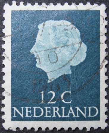 ISTANBUL, TURKEY - JANUARY 24, 2021: Netherlands stamp shows Queen Juliana circa 1953のeditorial素材