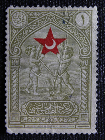 ISTANBUL, TURKEY - JANUARY 01, 2021: Turkish stamp shows Cherubs Upholding Star circa 1932のeditorial素材