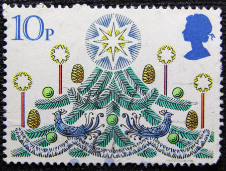 ISTANBUL, TURKEY - JANUARY 03, 2021: Great Britain stamp shows Christmas tree with Candles circa 1980のeditorial素材
