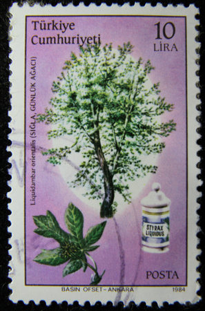 ISTANBUL, TURKEY - DECEMBER 27, 2020: Turkish stamp shows Liquidambar, liquidambar grease circa 1984のeditorial素材