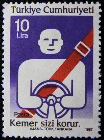 ISTANBUL, TURKEY - DECEMBER 26, 2020: Turkish stamp shows Road Safety, use seatbelts circa 1987