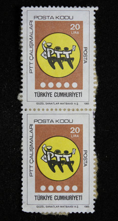 ISTANBUL, TURKEY - DECEMBER 29, 2020: Turkish stamp shows Postal Code Inauguration circa 1985のeditorial素材