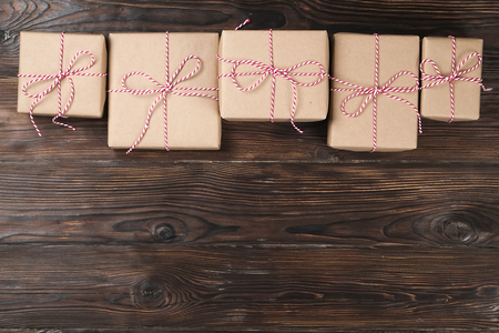 Christmas background with a gift box on a wooden backgroundの写真素材