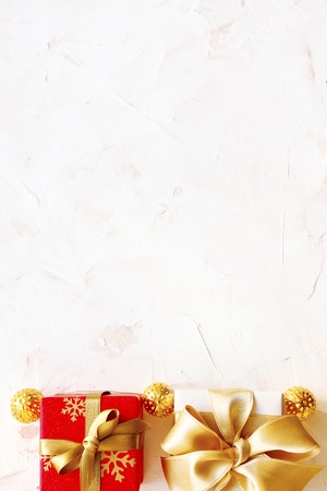 Christmas mood concept. Layout composition with traditional festive attributes, presents, red balls & other decorations. Winter holidays season. Background, copy space, close up, top view, flat lay.の写真素材