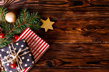 Christmas mood concept. Layout composition with traditional festive attributes, green decorative fresh pine tree branches. Winter holidays season. Background, copy space, close up, top view, flat lay.の写真素材