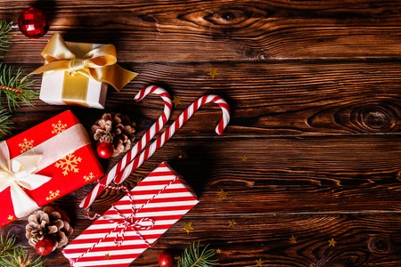 Christmas mood concept. Layout composition with traditional festive attributes, green decorative fresh pine tree branches. Winter holidays season. Background, copy space, close up, top view, flat lay.の写真素材