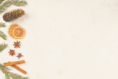 Christmas mood concept. Layout composition with traditional festive attributes, green decorative fresh pine tree branches. Winter holidays season. Background, copy space, close up, top view, flat lay.の写真素材