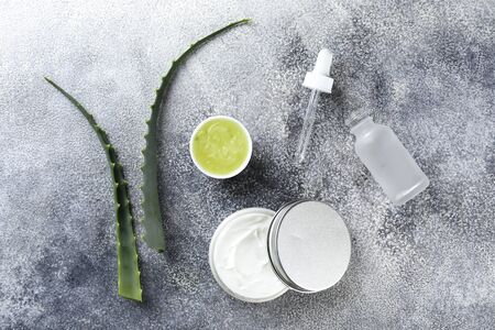 Minimalistic composition of sliced aloe vera leaves, for making moisturizing skincare gel. Organic homemade cosmetics concept. Close up, copy space, top view, flat lay.の写真素材