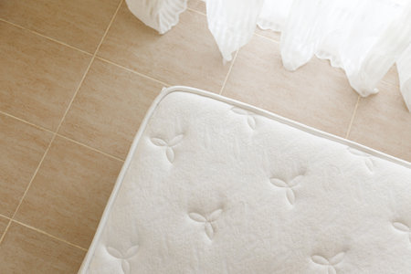 Close up shot of white orthopedic mattress surface pattern with a lot of copy space for text. Hypoallergenic foam matress for proper spinal alingment and pressure point relief. Background, top view.の写真素材