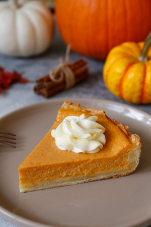 Slice of pumpkin pie on a plate. Selective focus.の写真素材