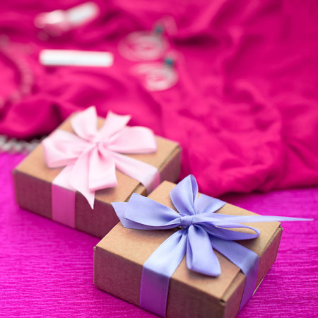 Gifts Packed in Kraft boxes tied with satin ribbon.
