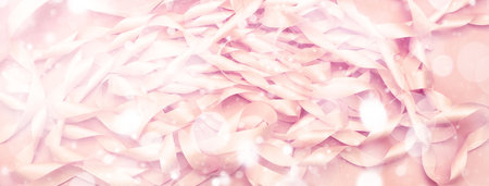 Banner A coil of decorative satin ribbons of pink color. Material for creativity of Fashion Design. Festive decorationの写真素材