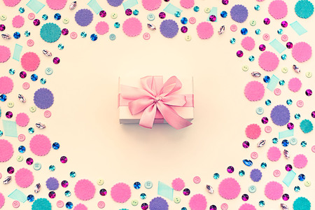 Gift box on festive pastel background. Flat lay top viewの写真素材