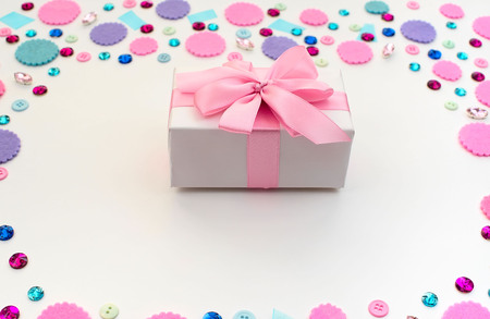 Gift box on festive pastel background. Flat lay top viewの写真素材