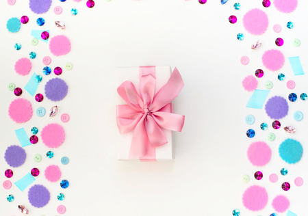 Gift box on festive pastel background. Flat lay top viewの写真素材