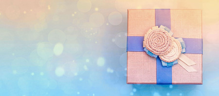 Banner One decorative gift box on a blue background. The concept of Christmas, Valentine's day. Top view flat lay. Squareの写真素材